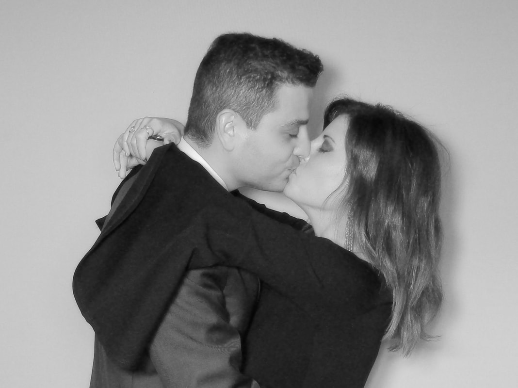Guest Using Photo Booth with White Backdrop